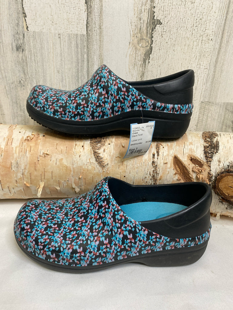 Crocs Size 7 Black Floral Slip-ons